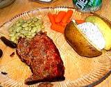 a photo of dinner plate of beef, carrots, and baked potato all natural sources of Vitamin B6 Pyridoxine