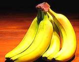 a photo of a hand of bananas a natural source of Vitamin B6 Pyridoxine