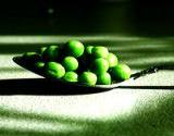 photo of a spoonful of peas a natural source of vitamin C