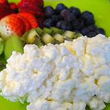 photo of a plate of cottage cheese and fruit good source of tryptophan