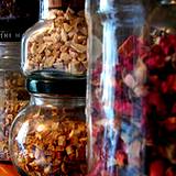 a photo of herbs stored in canning jars