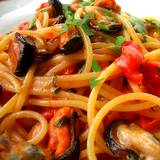 a photo of a plate of pasta and sauce with seafood a natural source of Vitamin B12