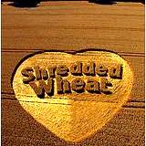photo of field of wheat with heart cut out and ingraved 